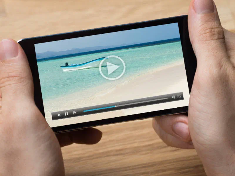 A video player with a play button on a mobile device.